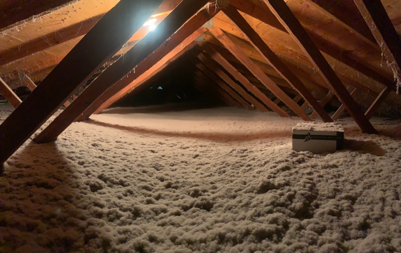 attic with freshly blown insulation in it to increase energy efficiency