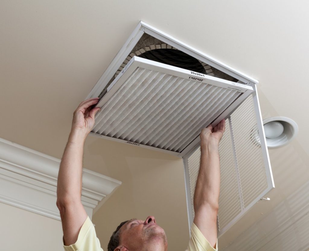 air filter being replaced to increase energy efficiency