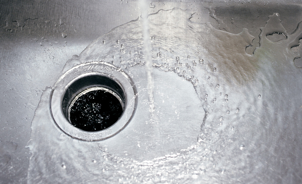 water running in a stainless steel sink